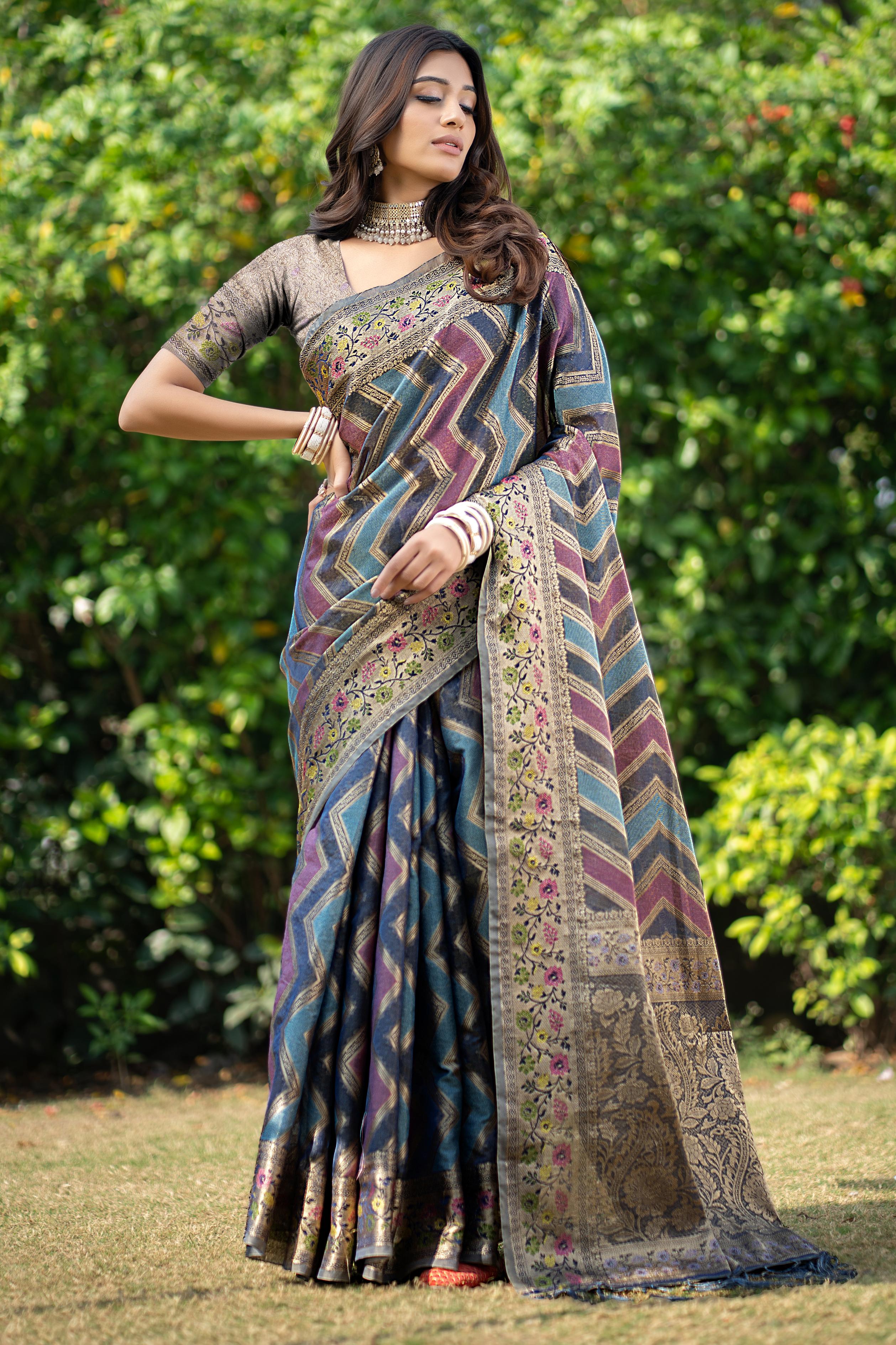 Model wearing organza leheriya zari woven saree