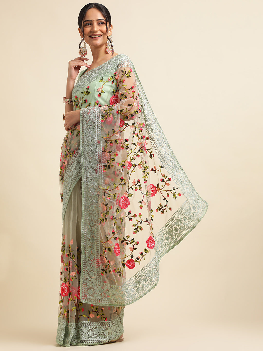 Model wearing net floral embroidered saree