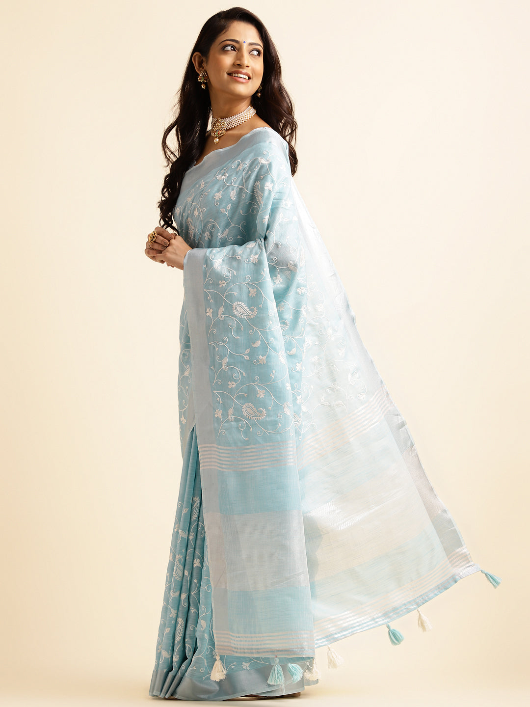 sky blue linen saree with bold floral patterns