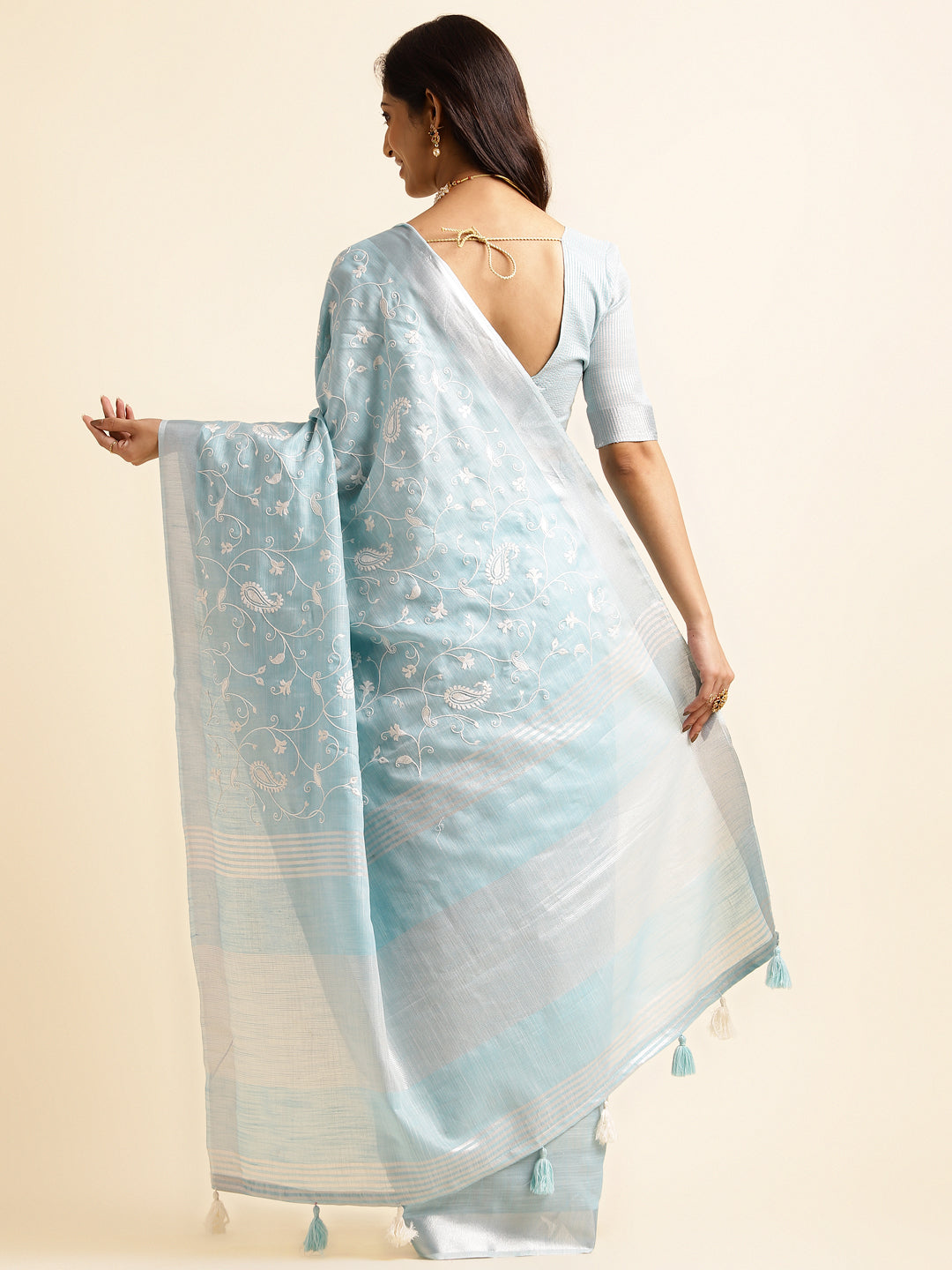 sky blue linen saree with bold floral work