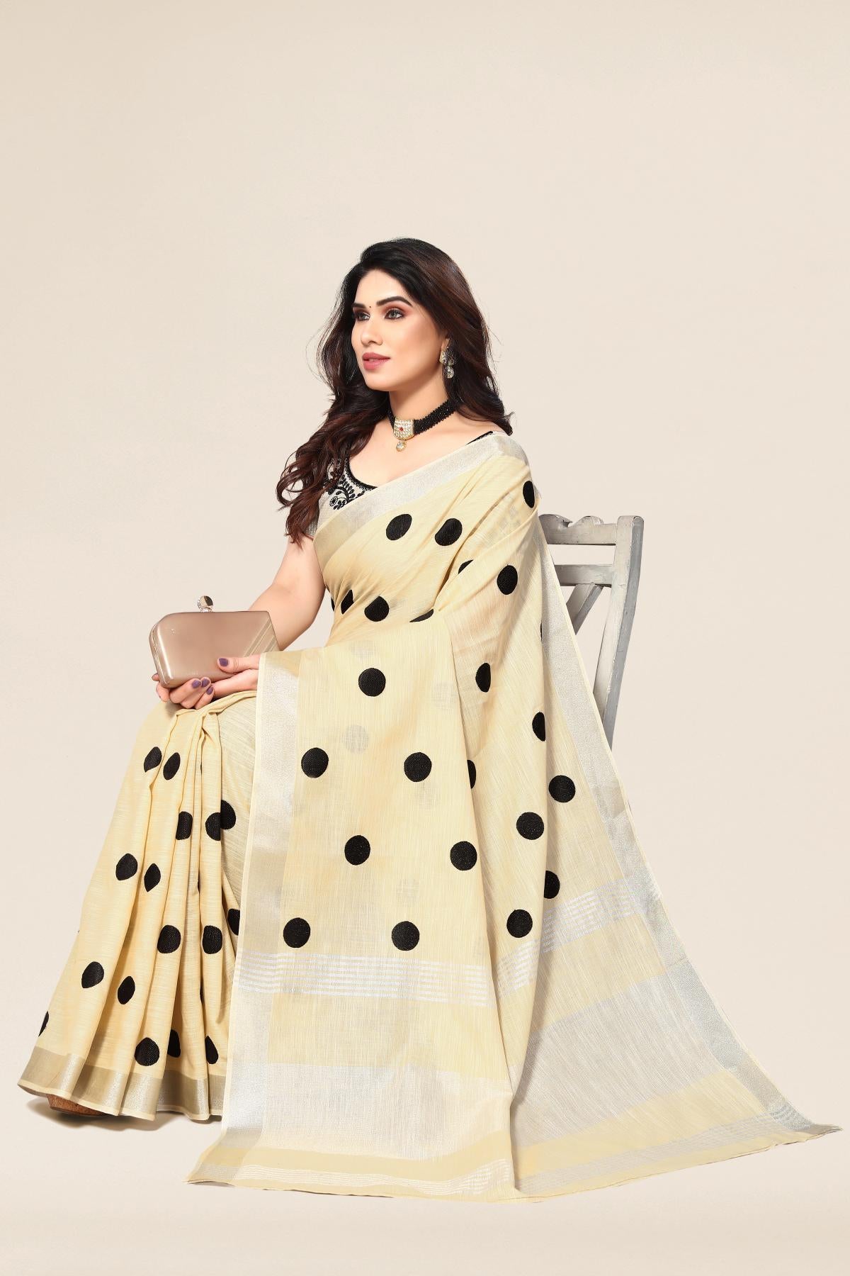 Cream linen saree with embroidered polka design