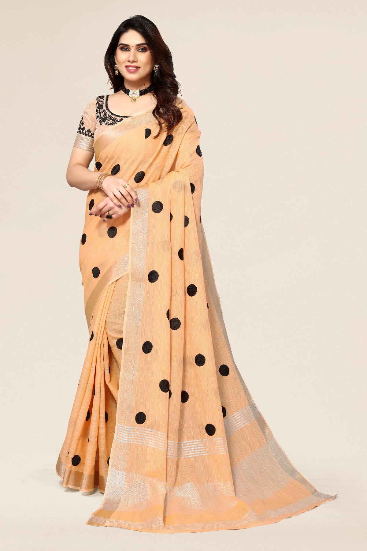 Orange linen saree with embroidered polka design