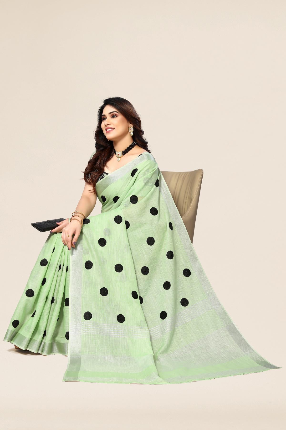 Green linen saree with embroidered polka design