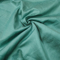 Close-up of teal fabric with folds