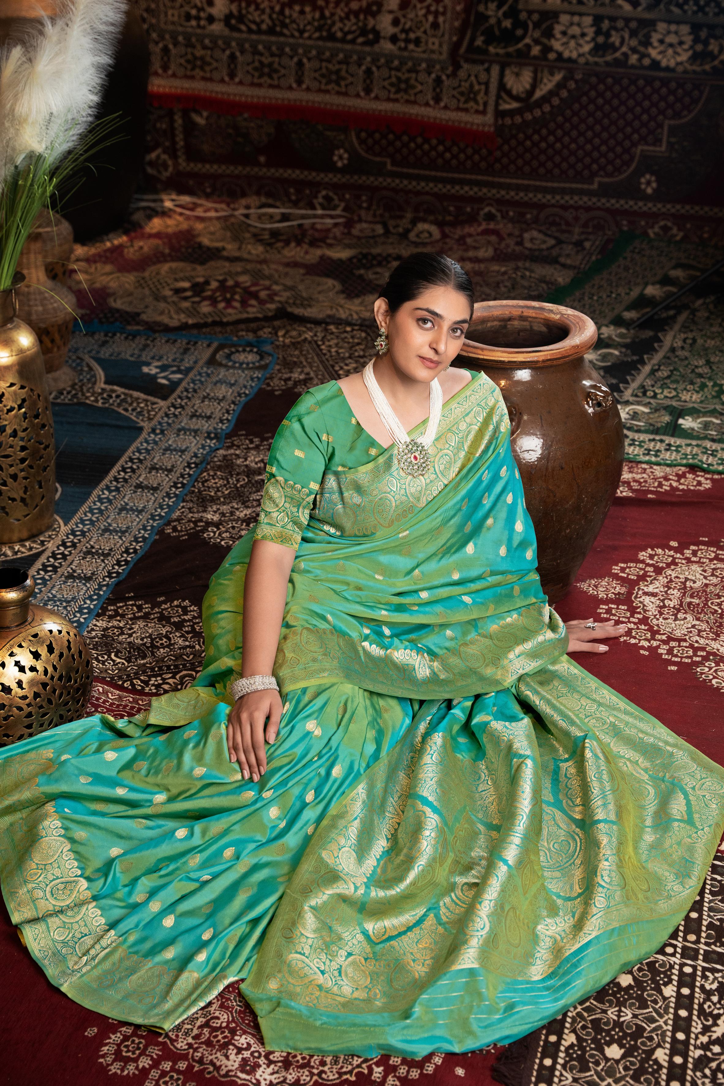 Green Banarasi silk blend saree with zari woven border