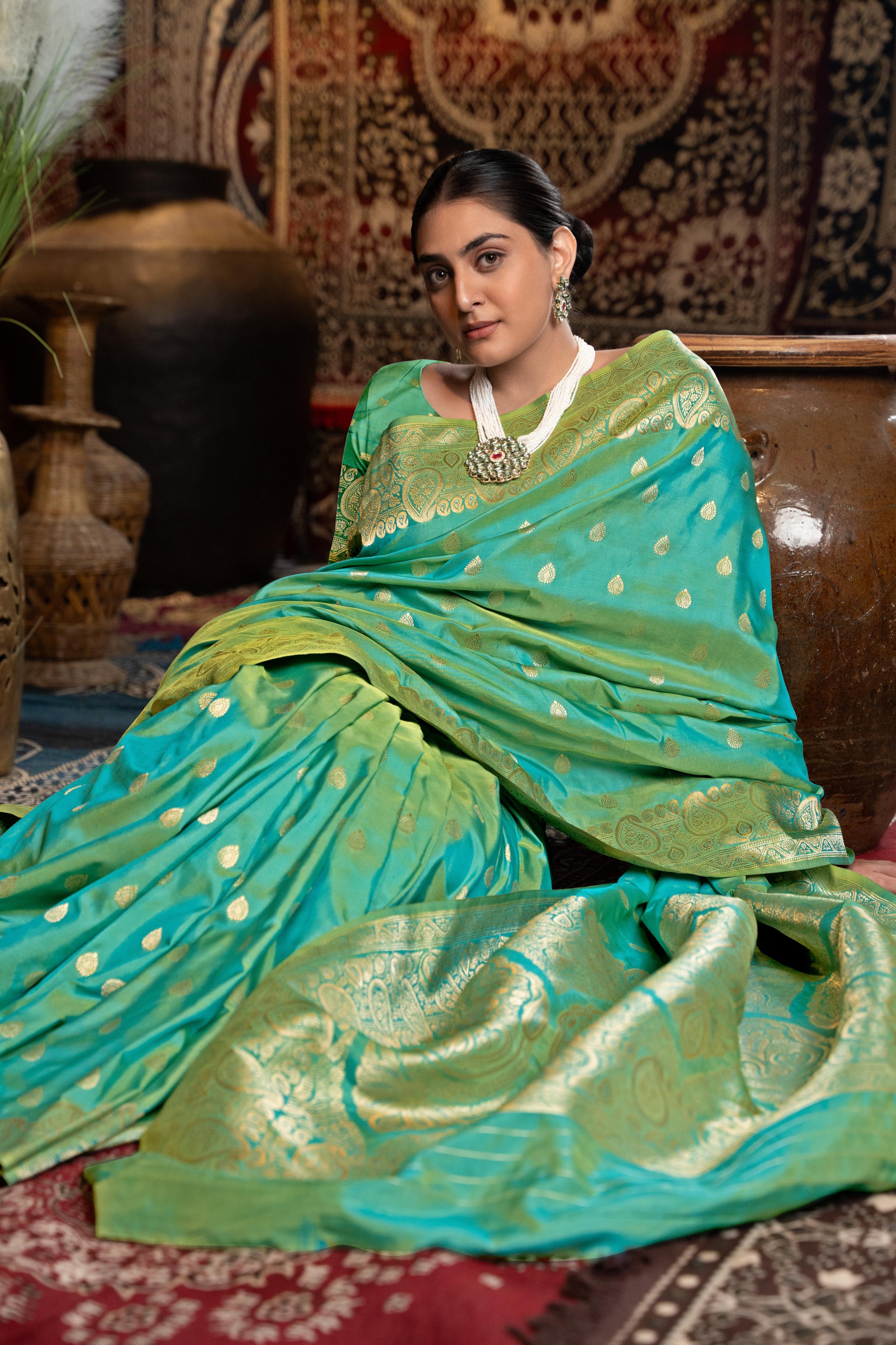 Green Banarasi silk blend saree with zari woven border