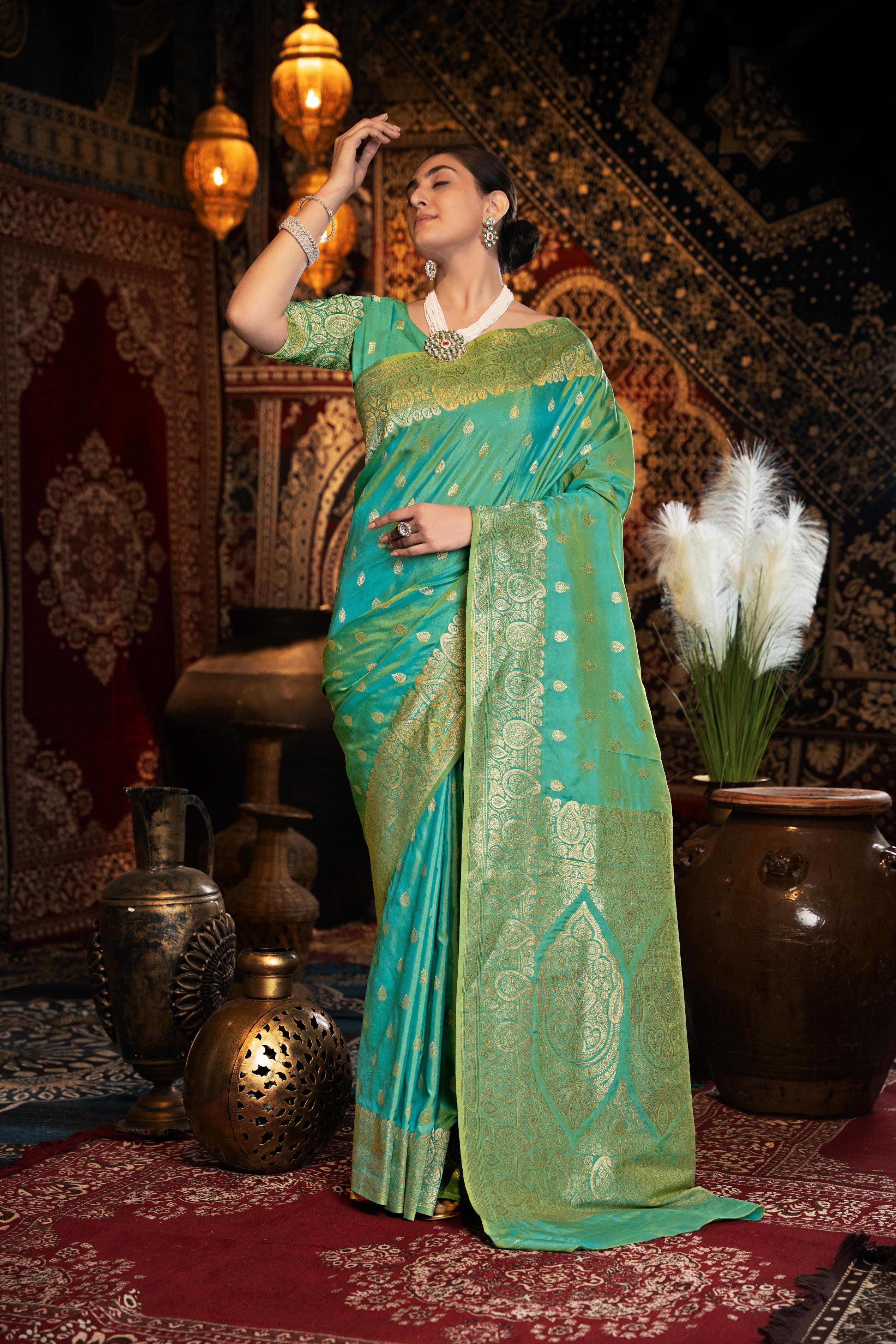 Green Banarasi silk blend saree with zari woven border