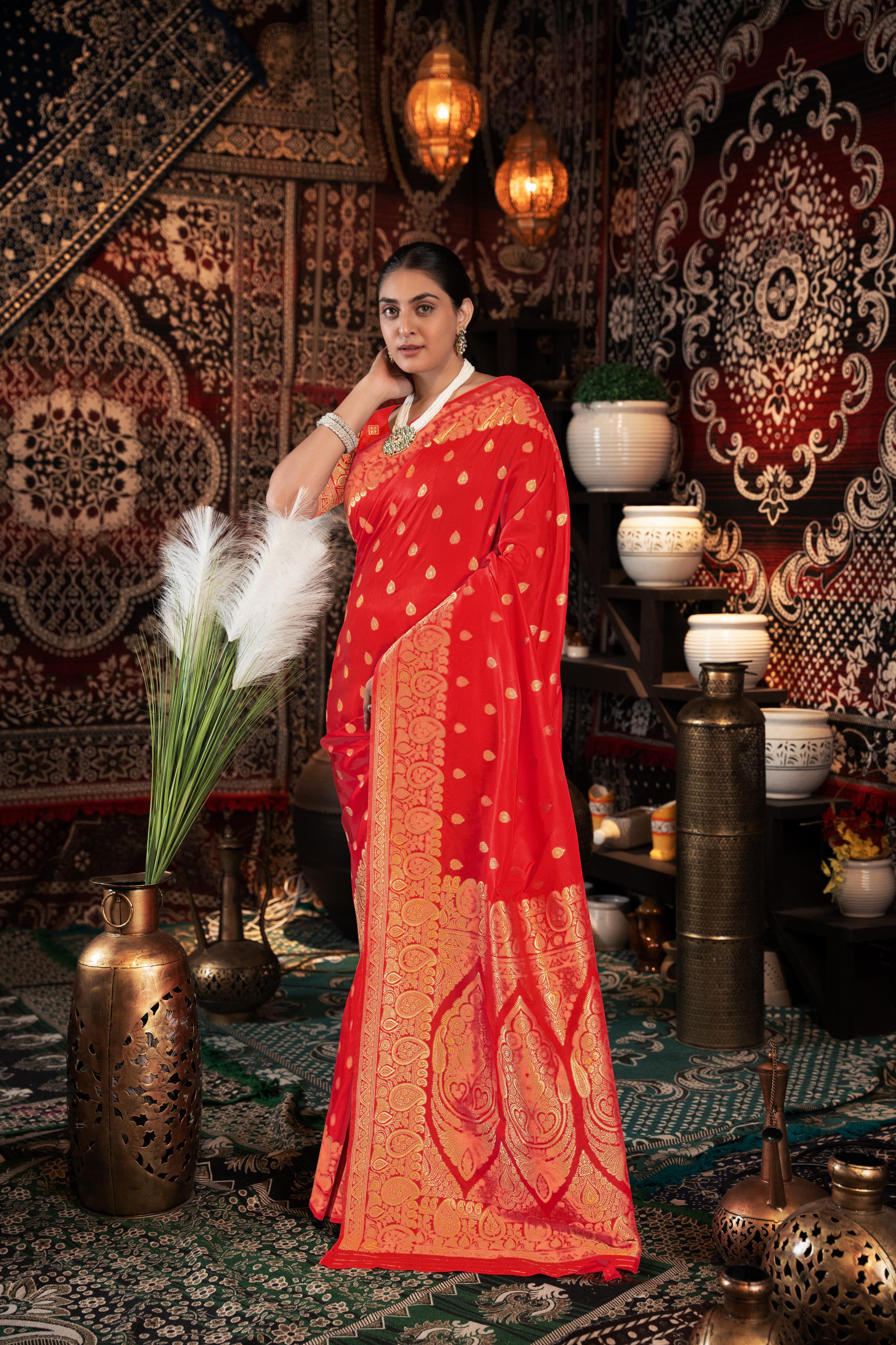 Red Banarasi silk blend saree with zari woven border