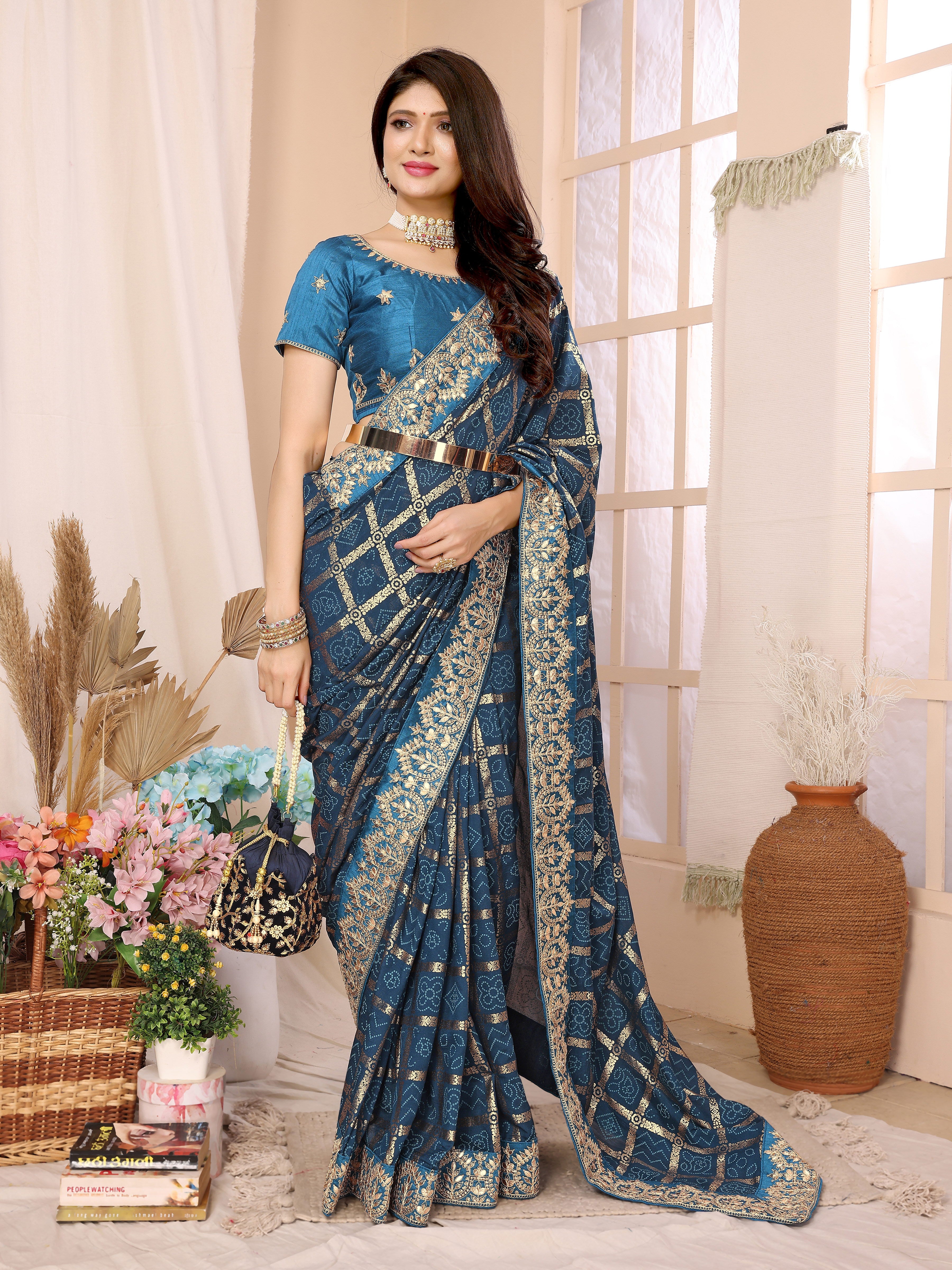 Traditional blue bandhani saree with zari border